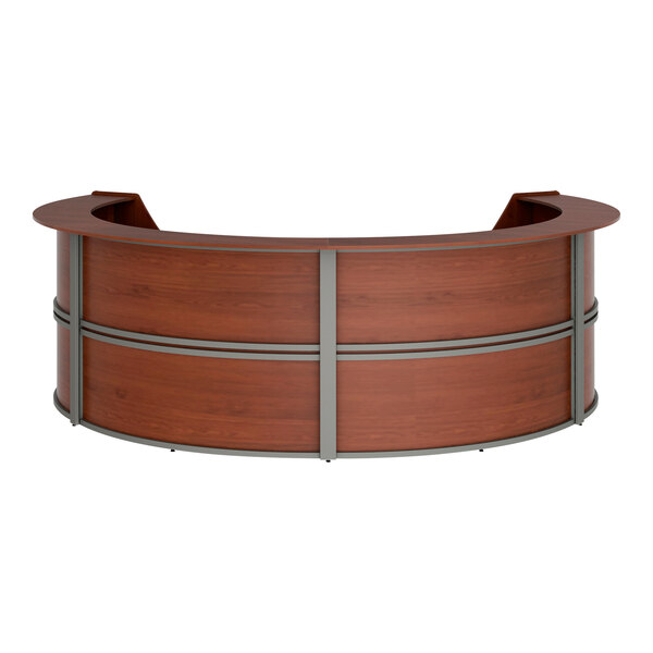 A wooden Correll curved U-shaped reception desk with a curved top.