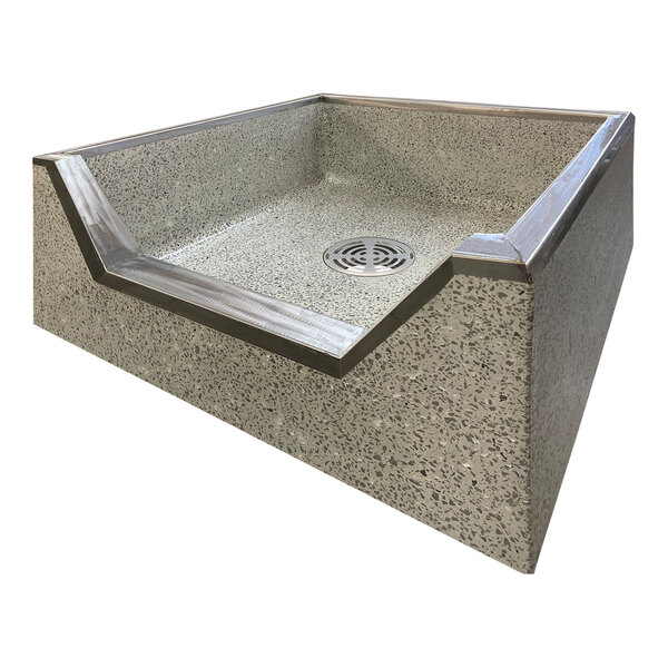 A square grey terrazzo mop sink basin with a drain.