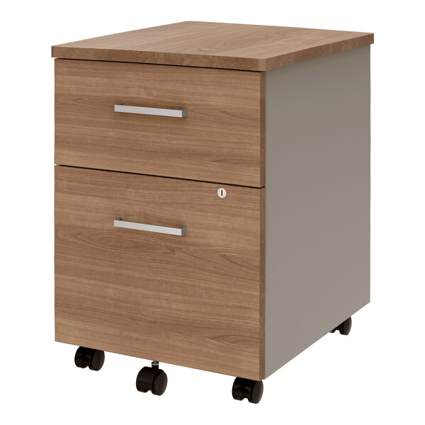 A steel mobile pedestal filing cabinet with two walnut laminate drawers and wheels.