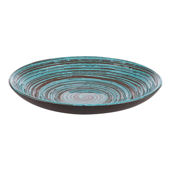 A blue and brown APS Cancun melamine plate with a swirl pattern.