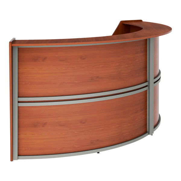 A Correll cherry laminate curved reception desk with a curved top and curved sides.