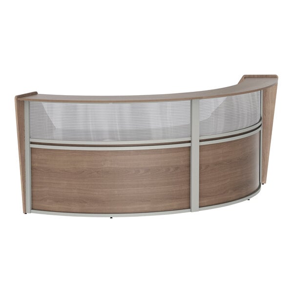 A Correll walnut laminate curved reception desk with glass panels.