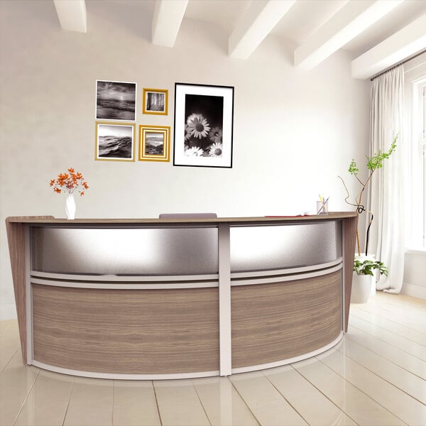A Correll walnut laminate curved reception desk with a counter.
