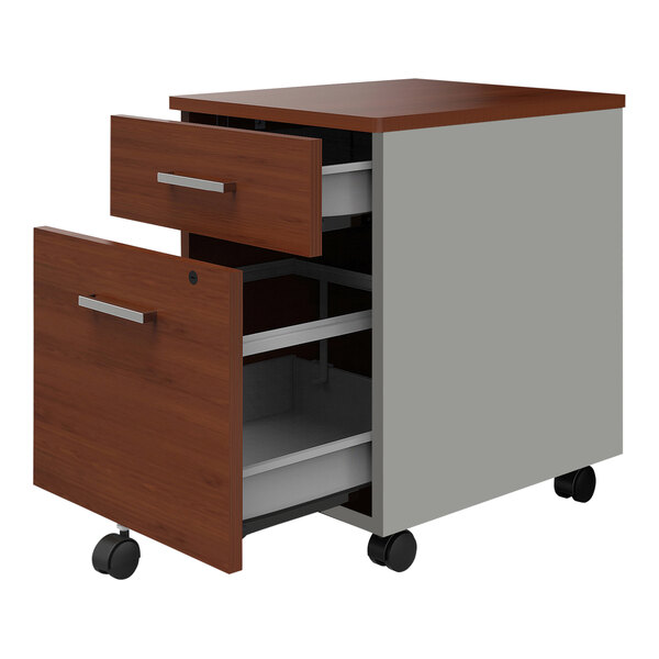 A Correll steel mobile pedestal filing cabinet with 2 cherry laminate drawers on wheels.