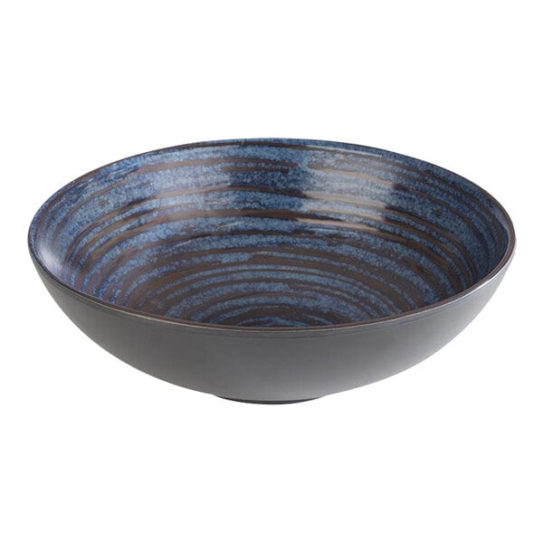 A white APS melamine bowl with a blue and black striped pattern.