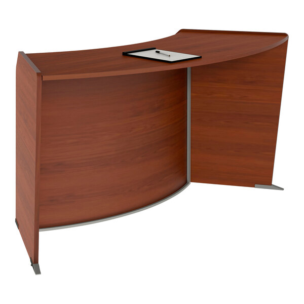 A Correll curved reception desk with a cherry laminate top.