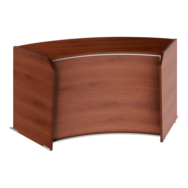 A cherry wood curved reception desk with a curved top.