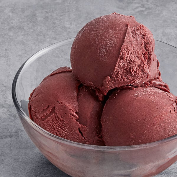 A close-up of three scoops of Tropical Acai Sorbet in a bowl.