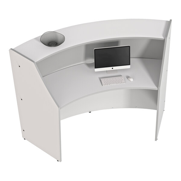 A white Correll curved reception counter with a computer and keyboard.
