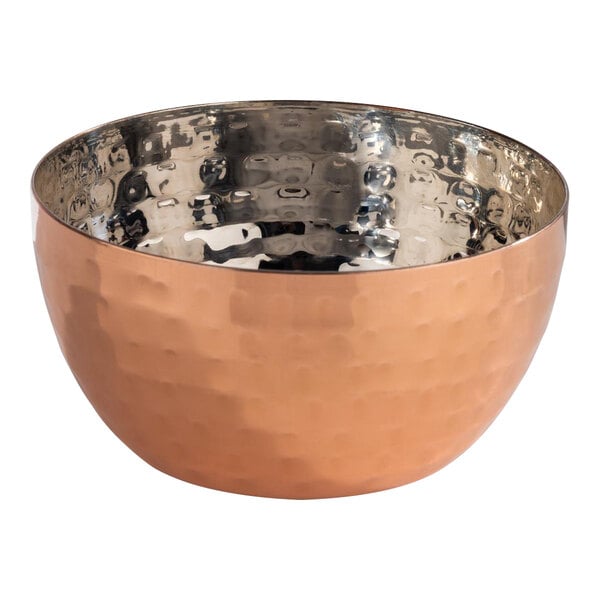 An APS Mumbai round hammered copper bowl.
