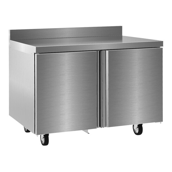 A Delfield stainless steel worktop refrigerator with two doors.
