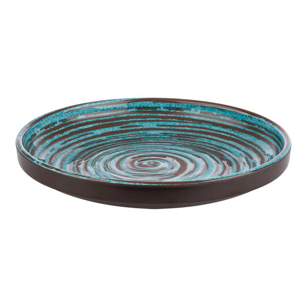 A brown and blue APS Cancun melamine plate with swirls.