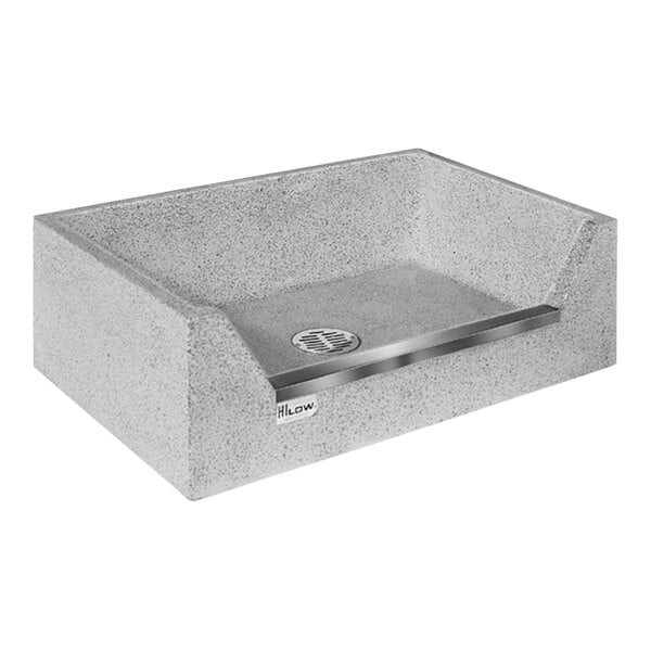 A rectangular stone mop sink basin with a stainless steel threshold.