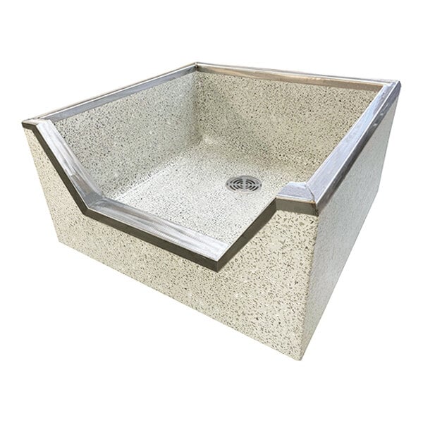 A square terrazzo mop sink basin with a speckled surface, stainless steel threshold cap, and a lowered front edge for easier access.
