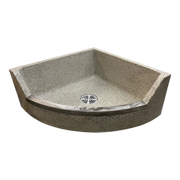 A close up of a Stern-Williams terrazzo corner mop sink basin with stainless steel caps.