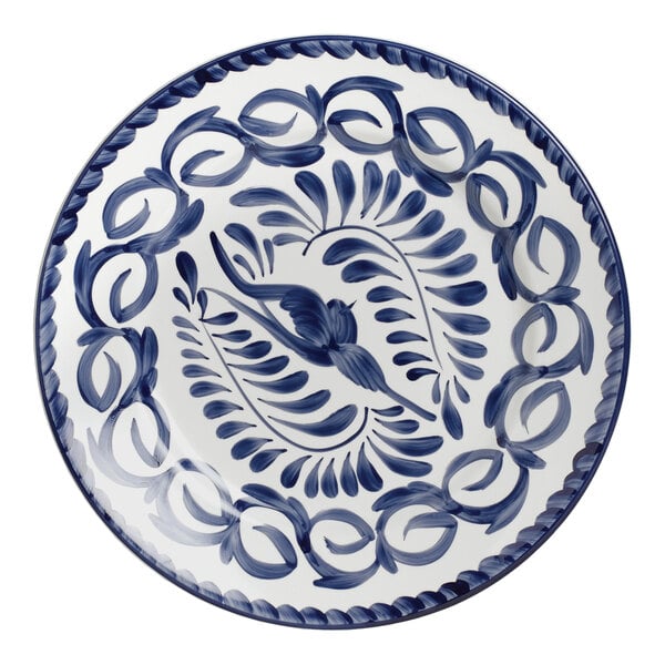 An Anfora Blue Puebla porcelain plate with a blue and white bird design.