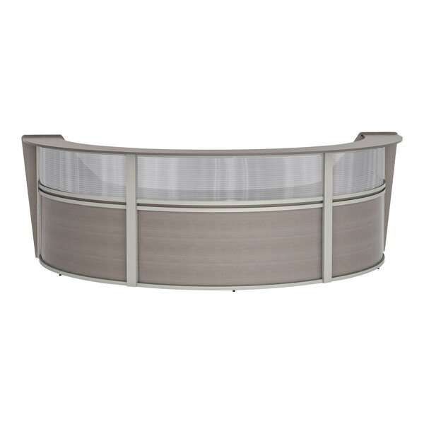 A Correll curved ash laminate reception desk with a glass top.
