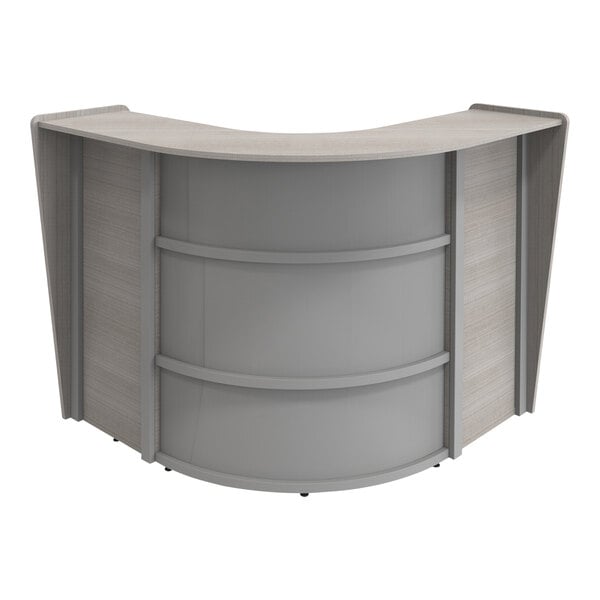 A Correll curved reception desk with an ash finish.