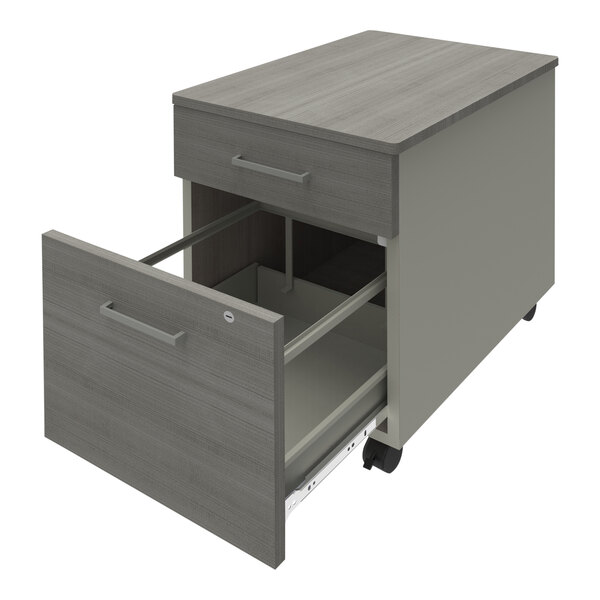 A Correll steel mobile pedestal filing cabinet with 2 ash laminate drawers on wheels.