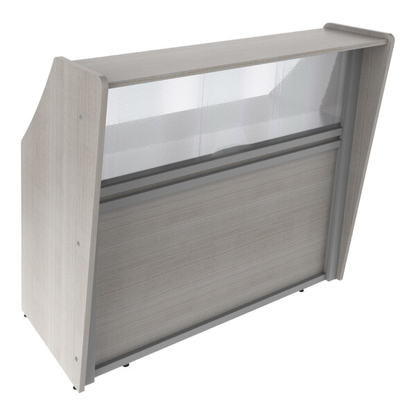 A wooden reception desk with a see-through glass panel.
