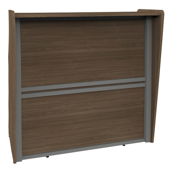 A brown and grey wood Correll reception desk with a sliding door and drawer.