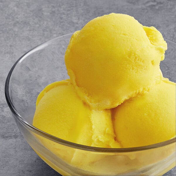 A bowl of yellow Tropical Acai Premium Passion Fruit Sorbet.