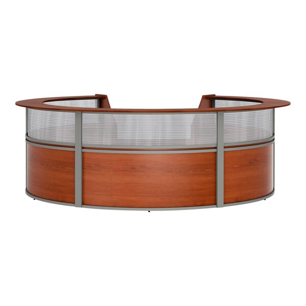 A cherry wood curved reception desk with a see-through top panel.