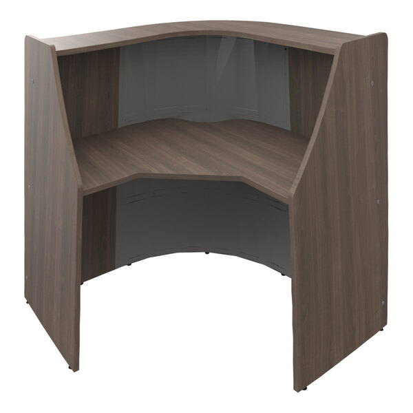 A wooden desk with a curved top.