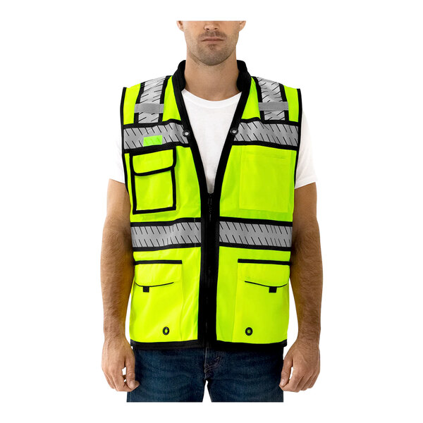 A man wearing a Tingley hi-vis yellow mesh safety vest with reflective tape.