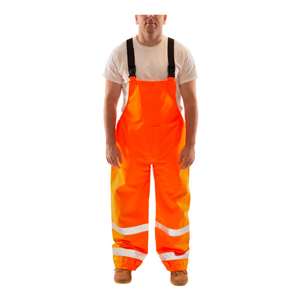 Tingley Icon Class E Hi-Vis Orange overalls with reflective stripes worn by a person