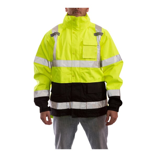 A man wearing a Tingley yellow and black safety jacket.