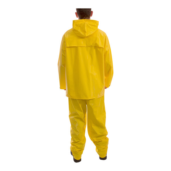 A person wearing a Tingley yellow rainsuit.