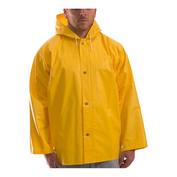 A man wearing a yellow Tingley American rain jacket.