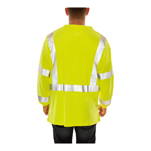 A man wearing a Tingley hi-vis lime yellow flame-resistant long sleeve shirt.