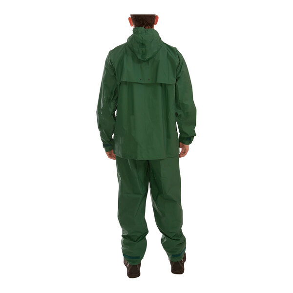 A man wearing a green Tingley Storm-Champ rainsuit.