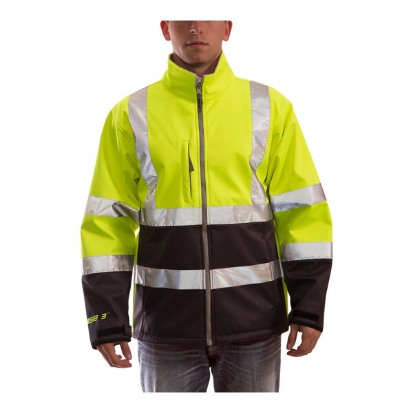 A man wearing a Tingley hi-vis lime soft shell jacket with charcoal gray panel.