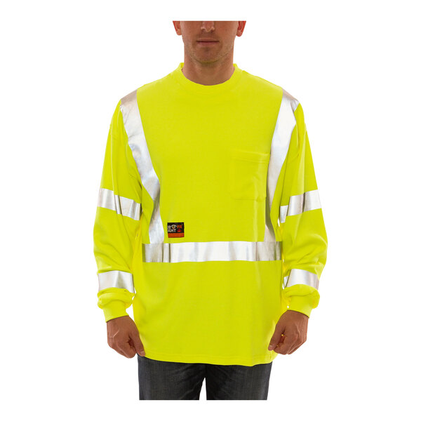A man wearing a Tingley lime yellow flame-resistant long sleeve safety shirt.