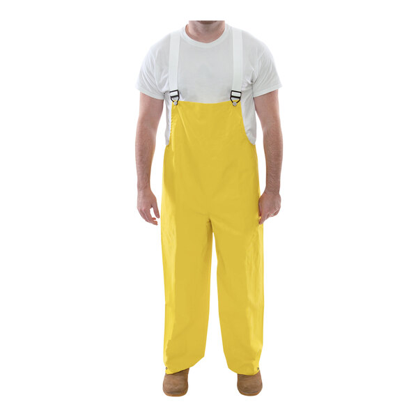 A man wearing yellow Tingley Magnaprene overalls.