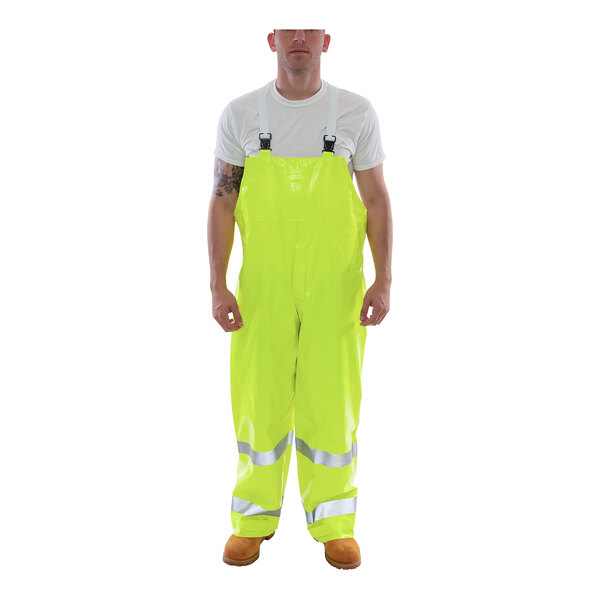 A man wearing Tingley Hi-Vis lime yellow overalls.