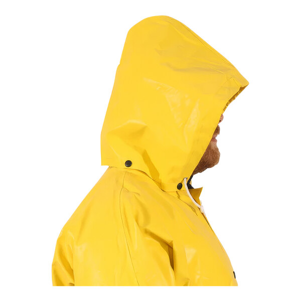 A man wearing a yellow Tingley WebDri raincoat.