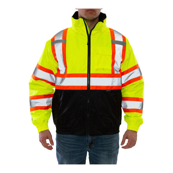 A person wearing a yellow and black Tingley Bomber II safety jacket.