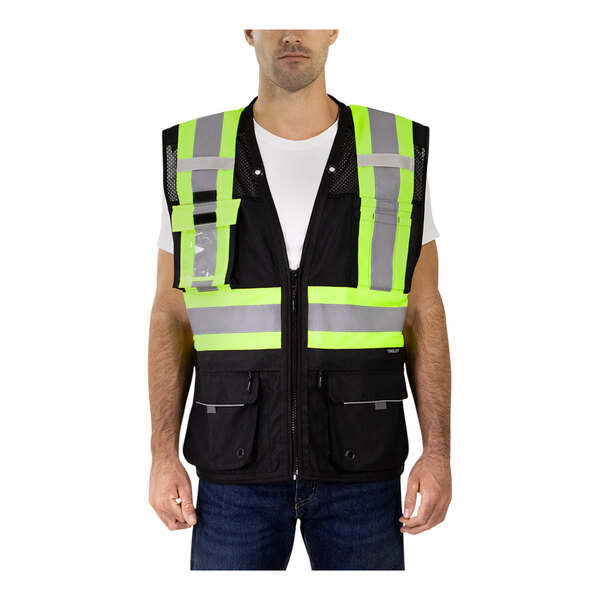 A man wearing a Tingley high-visibility safety vest with reflective tape.