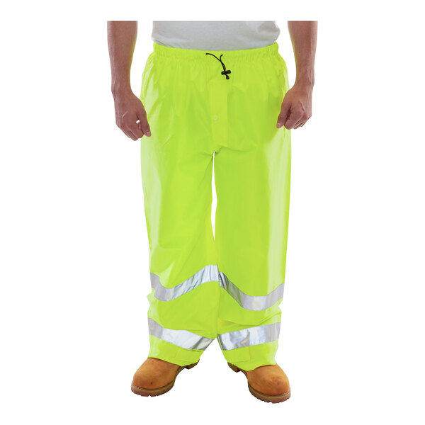A person wearing Tingley Vision hi-vis lime yellow pants.