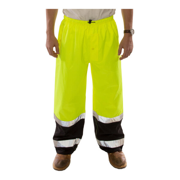 Tingley Icon LTE Class E Hi-Vis Lime pants with black cuffs on a person.