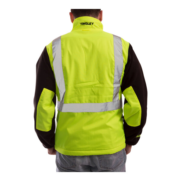 A person wearing a Tingley hi-vis lime and black fleece jacket.