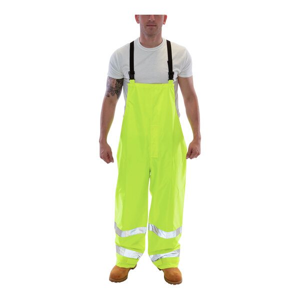 A man wearing Tingley hi-vis lime yellow overalls.