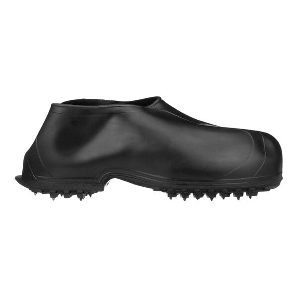 A black Tingley rubber overshoe with spikes on the sole.