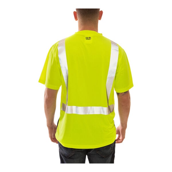 A man wearing a Tingley yellow safety shirt with black front panel and reflective stripes.