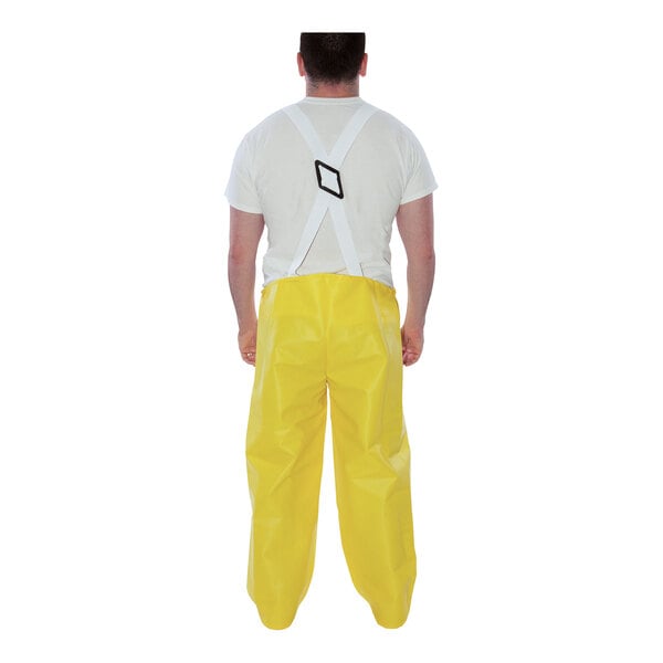 A man wearing yellow Tingley Webdri overalls.