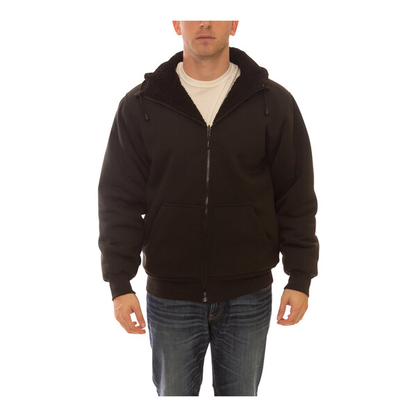 A man wearing a black Tingley Workreation zip-up sweatshirt.